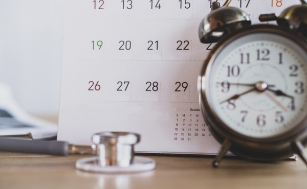 calendar with alarm clock and stethoscope 